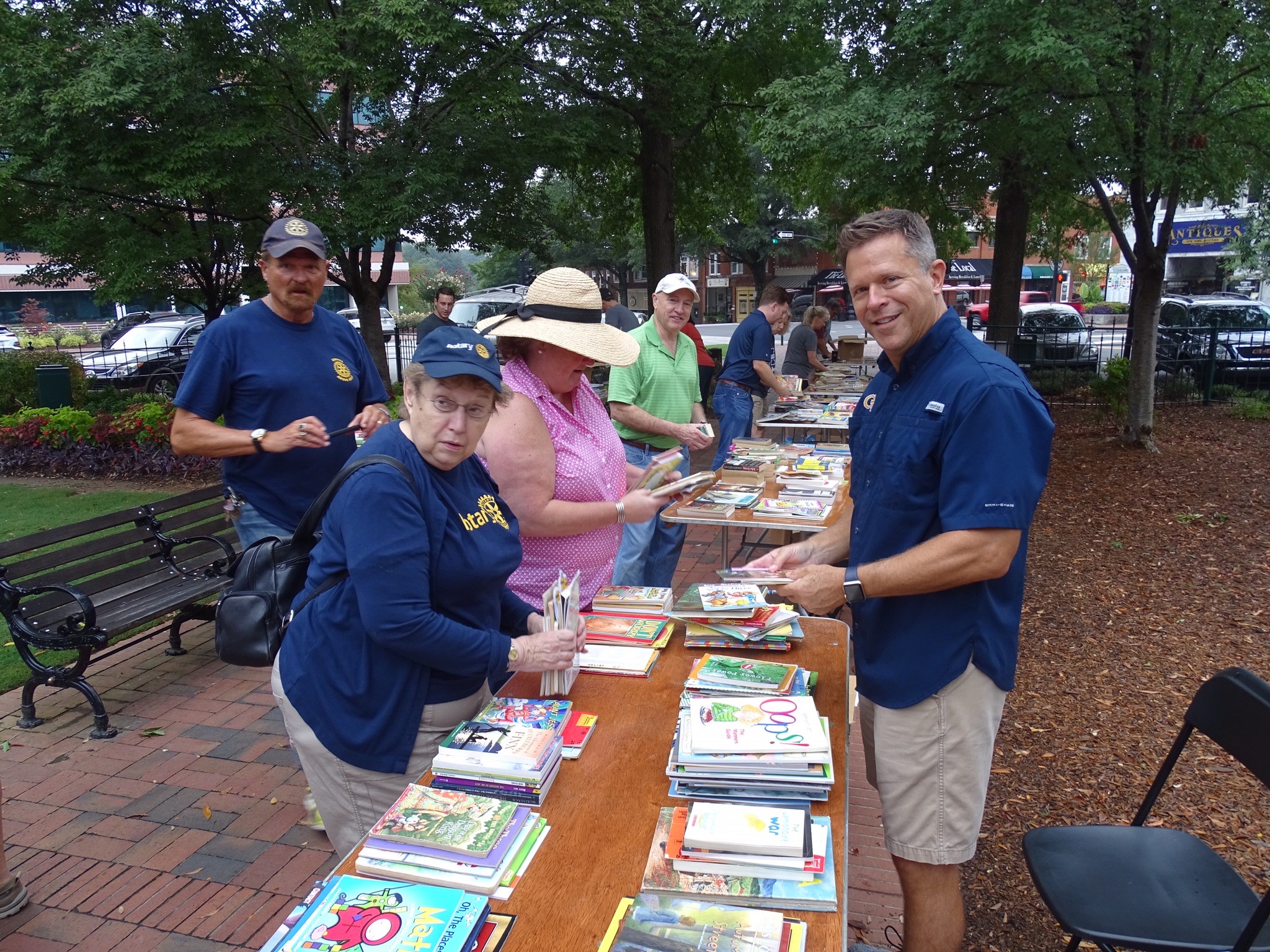 AG Mark Barbour, Marlys Williams, President Elect Mary Ansley Southerland, Abbott Hall and Jeff Cooper sort books.