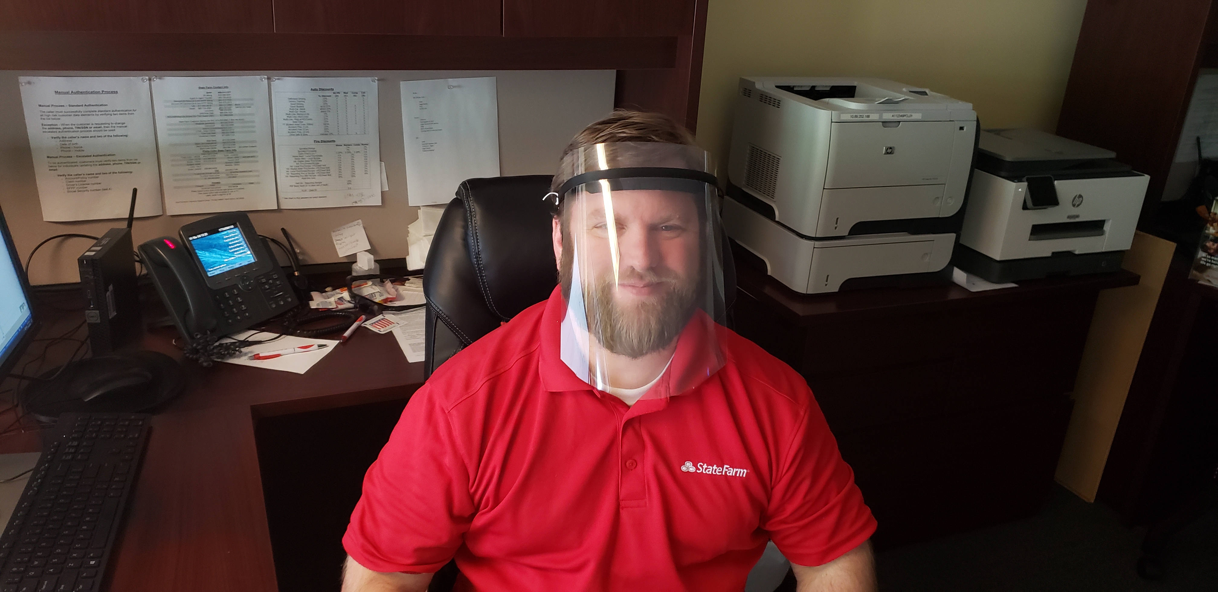 A State Farm employee trying out the mask Philip designed
